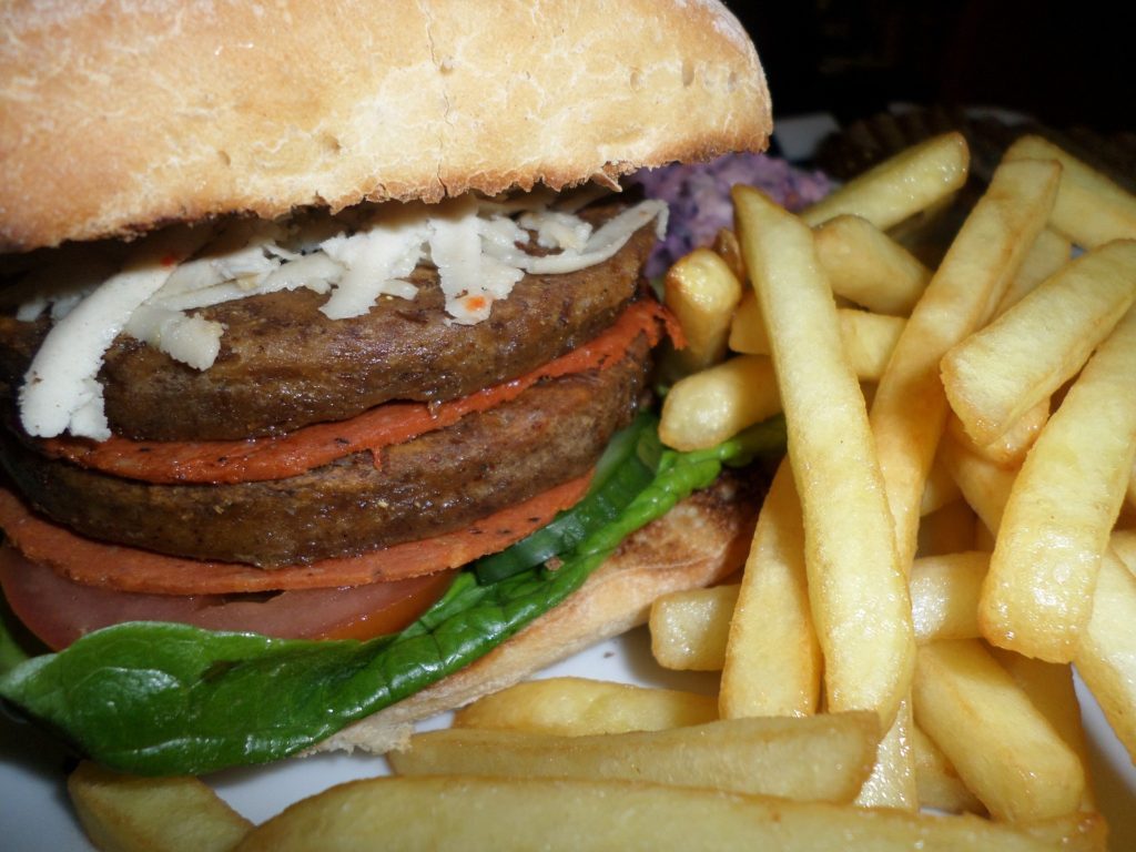 Vegan burger and french fries transition to a vegan diet